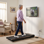 Older woman walking comfortably on the Belva walking pad in front of the television